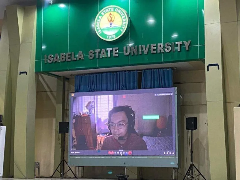 JC Diamante speaking remotely on the screen at Isabela State University